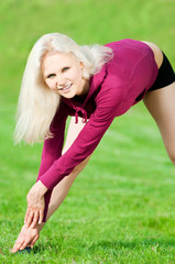 Beautiful woman doing yoga stretching exercise