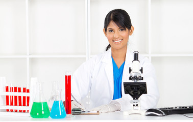 pretty indian female science researcher in lab