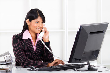 young businesswoman on the phone in office