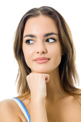 Portrait of thinking woman in sportswear, isolated