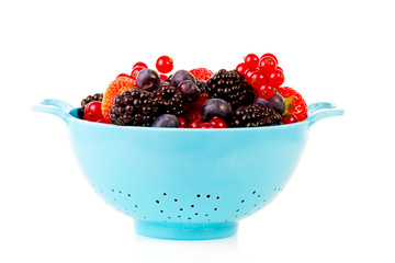 Blue colander with healthy fresh fruit