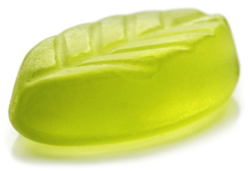 Leaf shaped jelly in green color on white background.