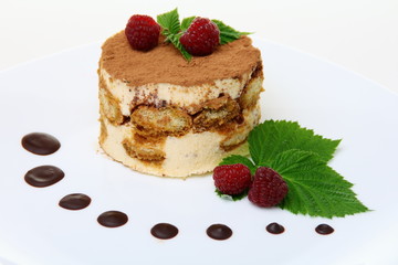 Tiramisu cake with raspberries.