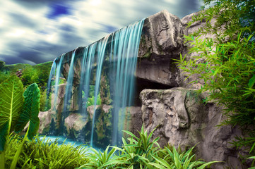 moving clouds over waterfall