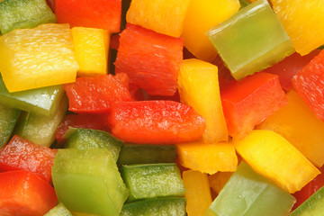 Slices of green, yellow and red bell pepper