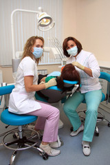 Young female patient takes a dental attendance