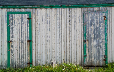 Closeup of an old white fishing shed
