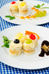 Plate full of tasty mini cakes