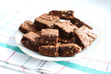 plate with cocoa homemade brownies, isolated
