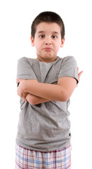 Boy wearing pijamas over white background.