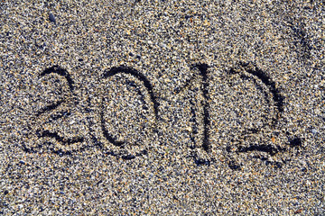 Inscription of year 2012 on sea coast