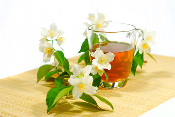 tea with jasmine flower on bamboo