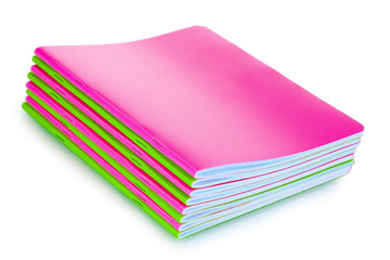 Green and pink notebooks isolated on white