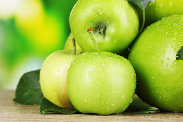 Fototapeta na wymiar Fresh organic apples on wooden table isolated on white