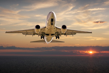 Airplane Landing at Sunset