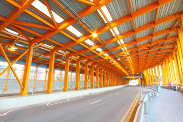 Orange tunnel and highway at day