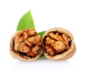 walnuts and leaves isolated on white