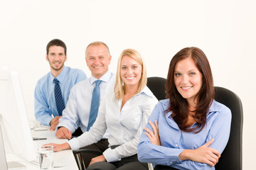 Business team happy sit in line behind table