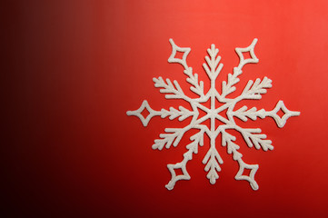 The big snowflake on a red background