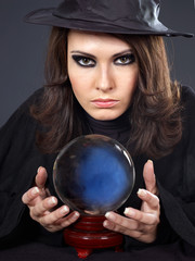 Young woman with crystal ball.