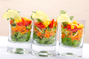 Delicious salad in the glasses