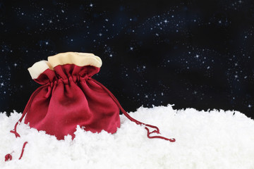 Red satin sack on snow
