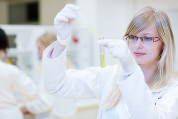 female researcher carrying out research in a lab