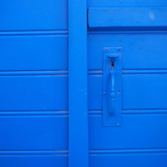 old blue door and handle closeup