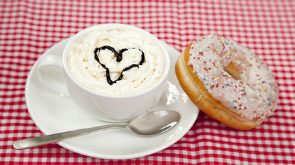 donuts with coffee on table.