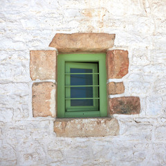 green window in a Greek island