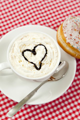 donuts with coffee on table.
