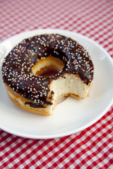 Cut donut on table.