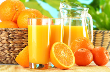 Composition with two glasses of orange juice and fruits