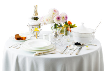 table with dishes and flowers