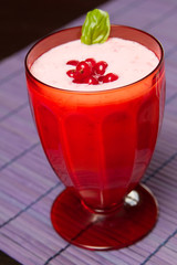 a red currant milkshake in red glass