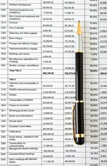 Pen on financial documents