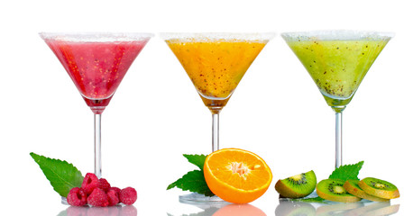Delicious fruit smoothies and fruit isolated on white