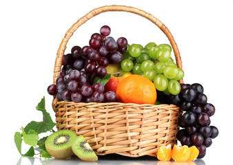 Ripe juicy fruits in  basket isolated on white