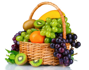 Ripe juicy fruits in  basket isolated on white