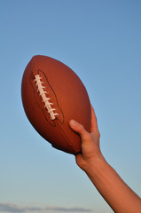 American Football Player Holding the Ball