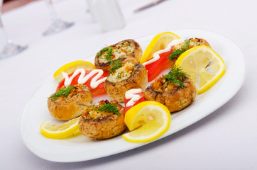 Stuffed mushroom served in the plate