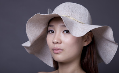 Portrait of a chinese woman with summer hat