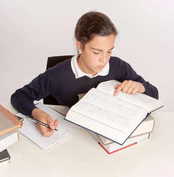 Schoolgirl writing an essay