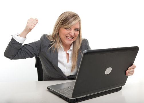 Businesswoman attacking her computer