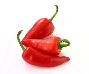 Red hot chilli peppers isolated on white background