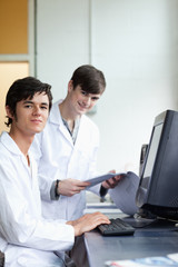 Fototapeta na wymiar Portrait of male scientists with a monitor
