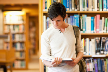 Serious student reading a book