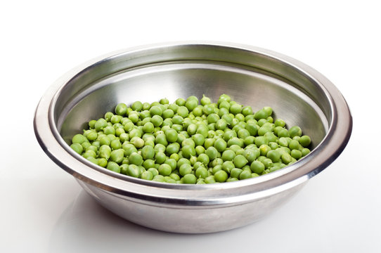 fresh green peas in a metal plate