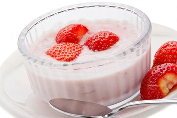 Strawberry yogurt with fresh strawberries in a glass bowl