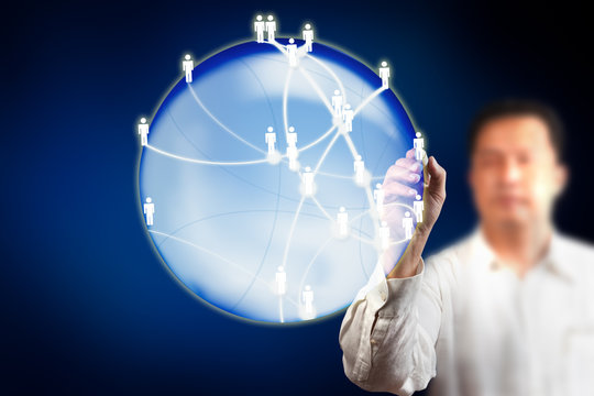 business man drawing social media icons on digital globe